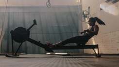 person on rowing machine