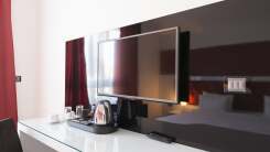 TV on wall in hotel room