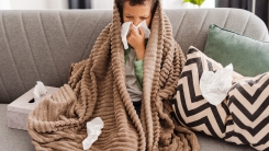 sick boy on couch