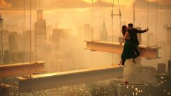 A still from Megalopolis featuring Adam Driver in the sky among the girders of a building under construction