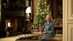 A woman unwraps a present in a scene from "Carol."