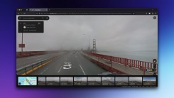A Google Street View image of the Golden Gate Bridge in San Francisco, CA, from 2016, with the bridge shrouded in the clouds.