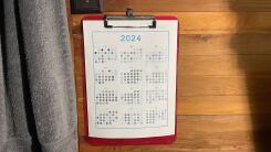 the bubble calendar, hanging on a clipboard on my wall