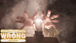 A fortune teller's hands conjure up a crystal ball.