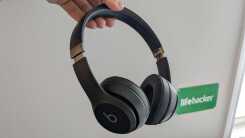 Me holding the Beats Solo 4 headphones.