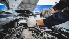 man working on a car engine
