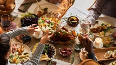 People sharing Thanksgiving dinner