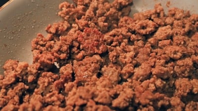 Crispy ground beef in a pan.