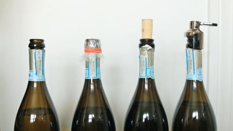 Four bottles of prosecco with different seals.