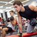 bros lifting dumbbells in the gym