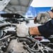 man working on a car engine