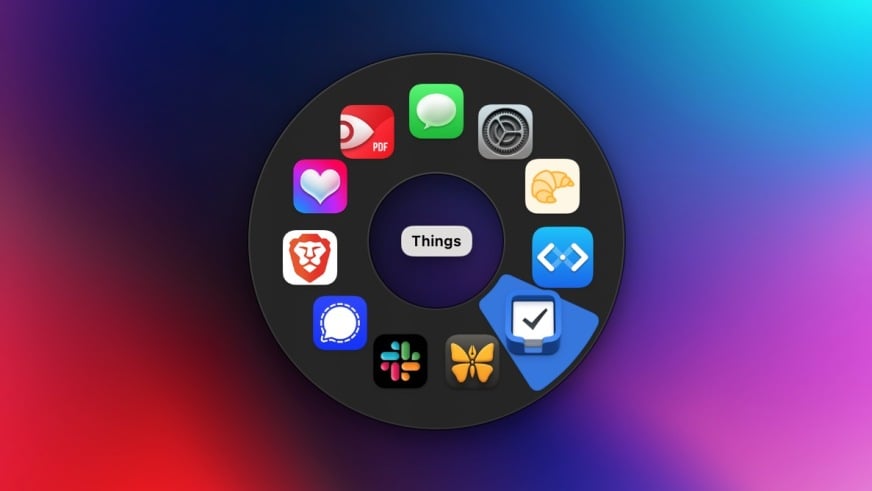 A radial app launcher running on a Mac. 10 apps are in a circle, with Things being the selected app.