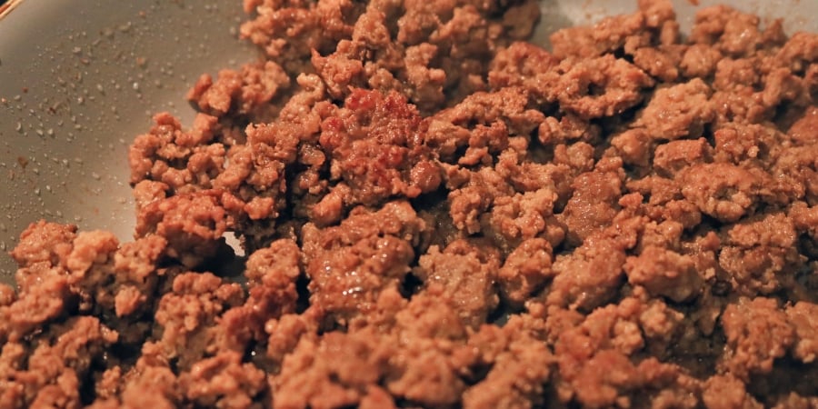 Crispy ground beef in a pan.