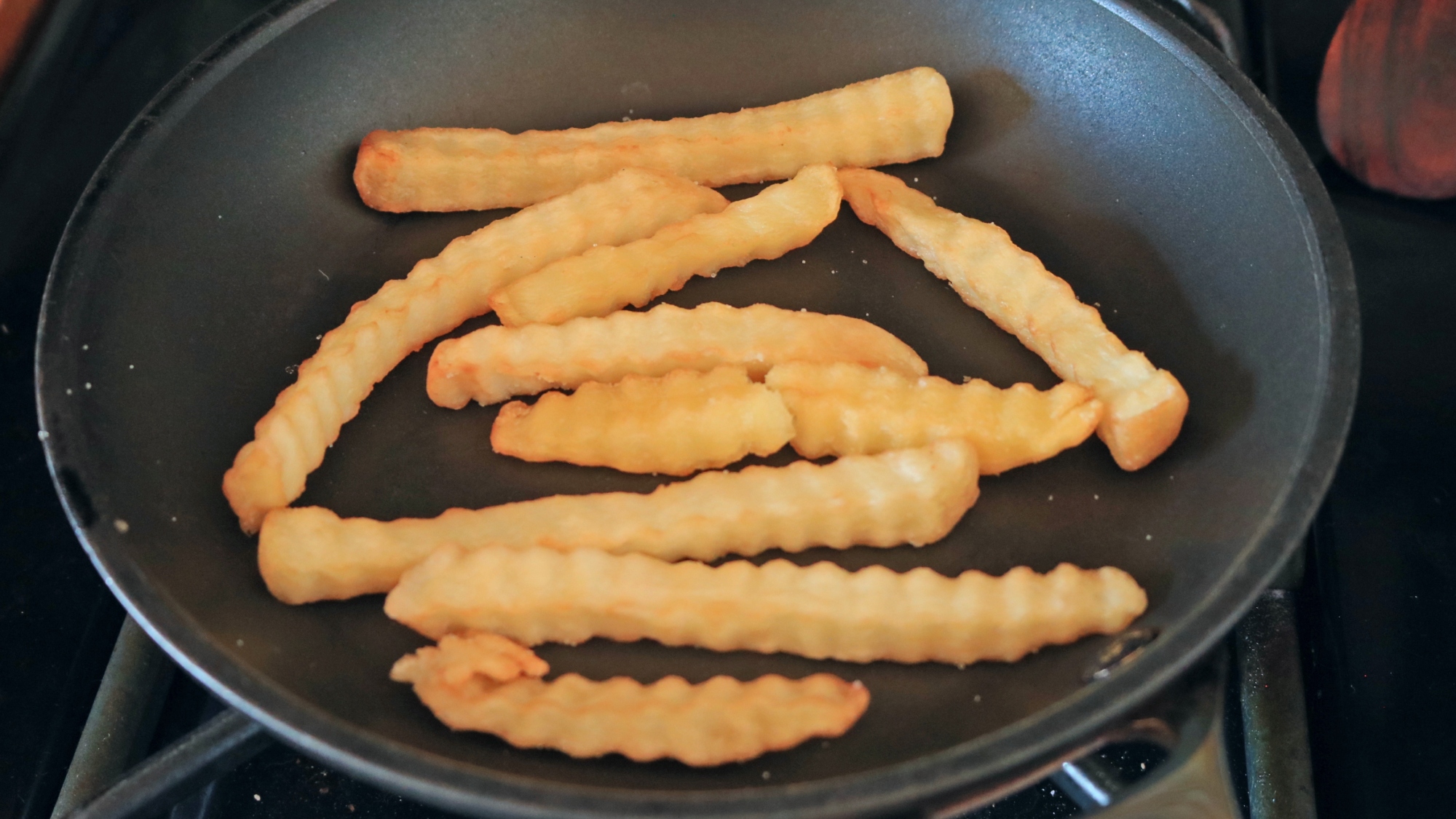 French fries in a frying pan.
