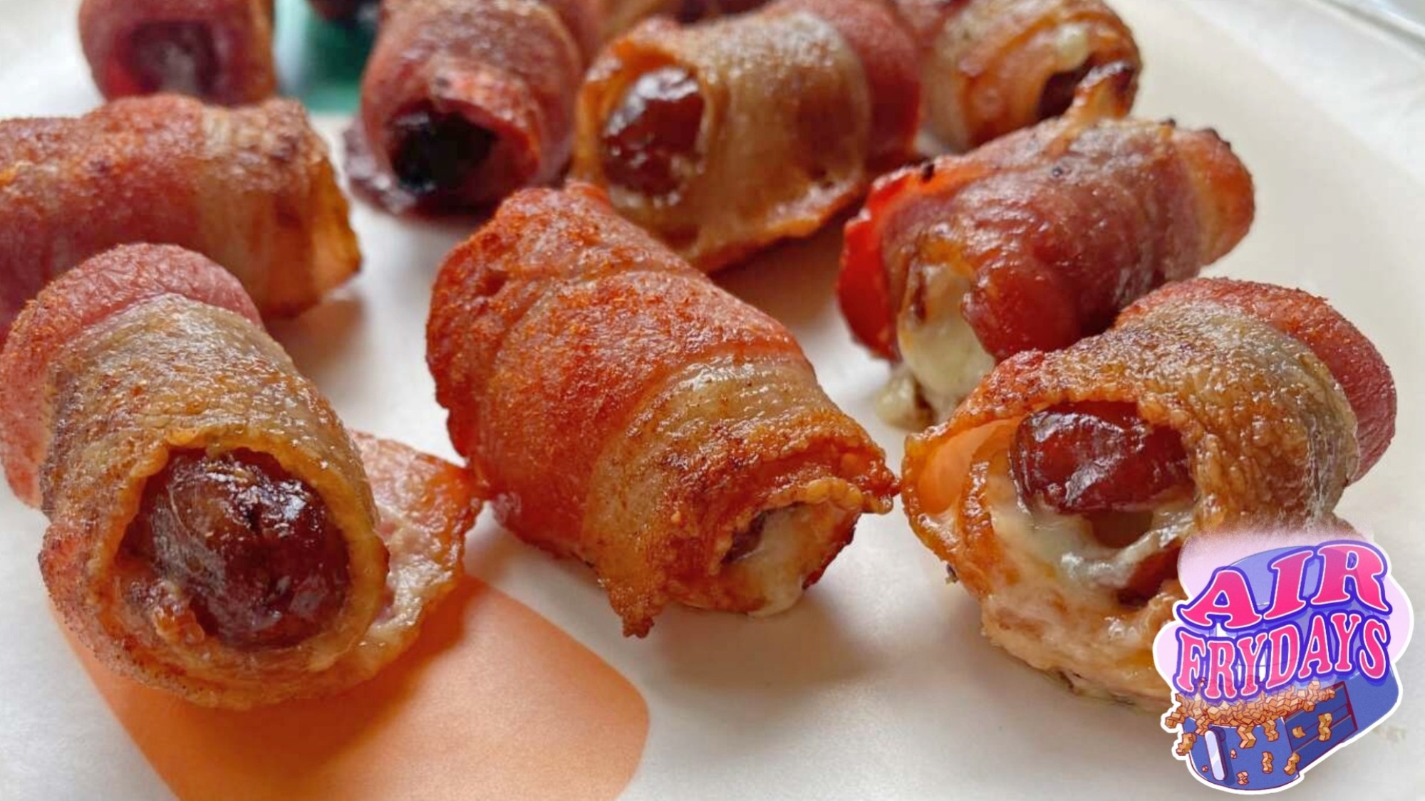 Bacon-wrapped dates on a plate.
