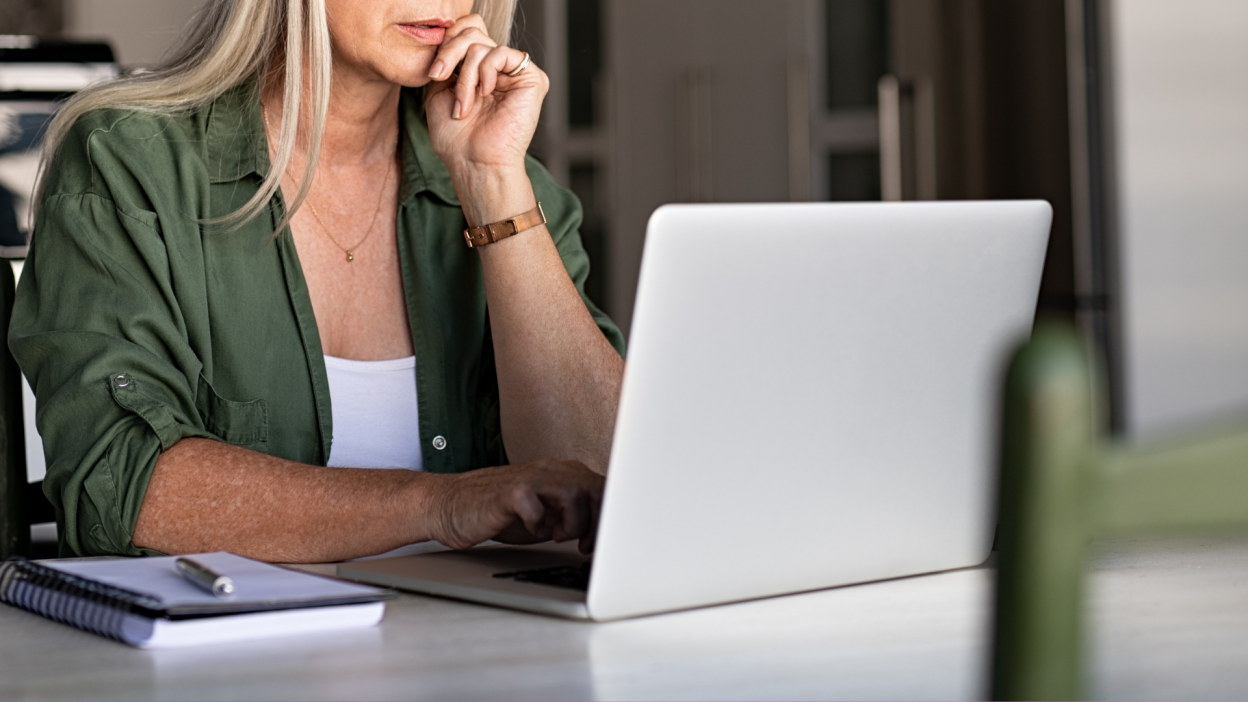 Older woman focused on laptop