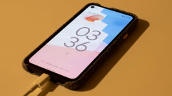 google pixel 4a plugged in to charge on a table