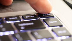 Close-up of someone pressing delete button