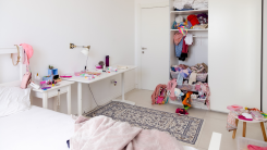 A cluttered bedroom closet