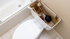 view of the inside of an open toilet tank