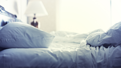 a bed with rumpled sheets