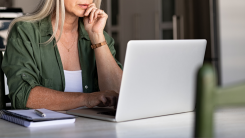 Older woman focused on laptop