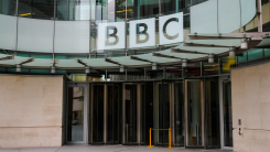 outside BBC building, large sign and front doors