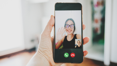 A person makes a call on a mock version of FaceTime