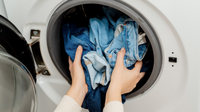 person taking clothing out of dryer