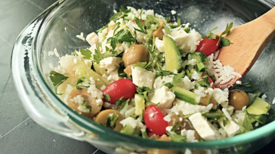 A rice and vegetable salad in a bowl.