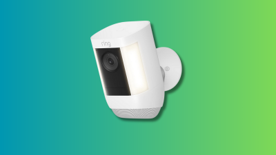 Ring Spotlight Cam Pro on a teal and green background. 