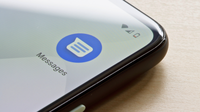 Android phone displaying Google Messages logo