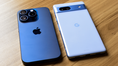 iphone and google pixel phones on table next to each other