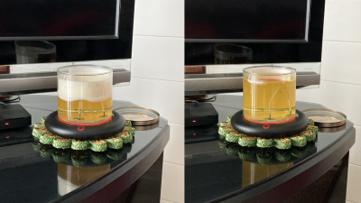 A candle burning on a mug warmer