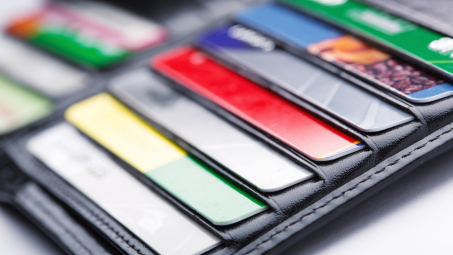 A leather wallet with credit cards poking out