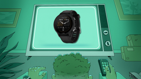 Man watching television screen displaying a Garmin Forerunner 955.