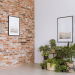 A brick wall with art on it in a contemporary home