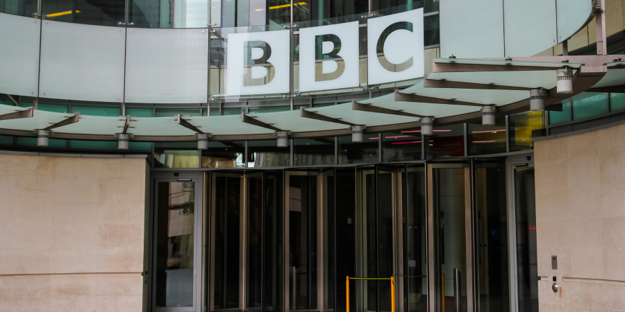 outside BBC building, large sign and front doors