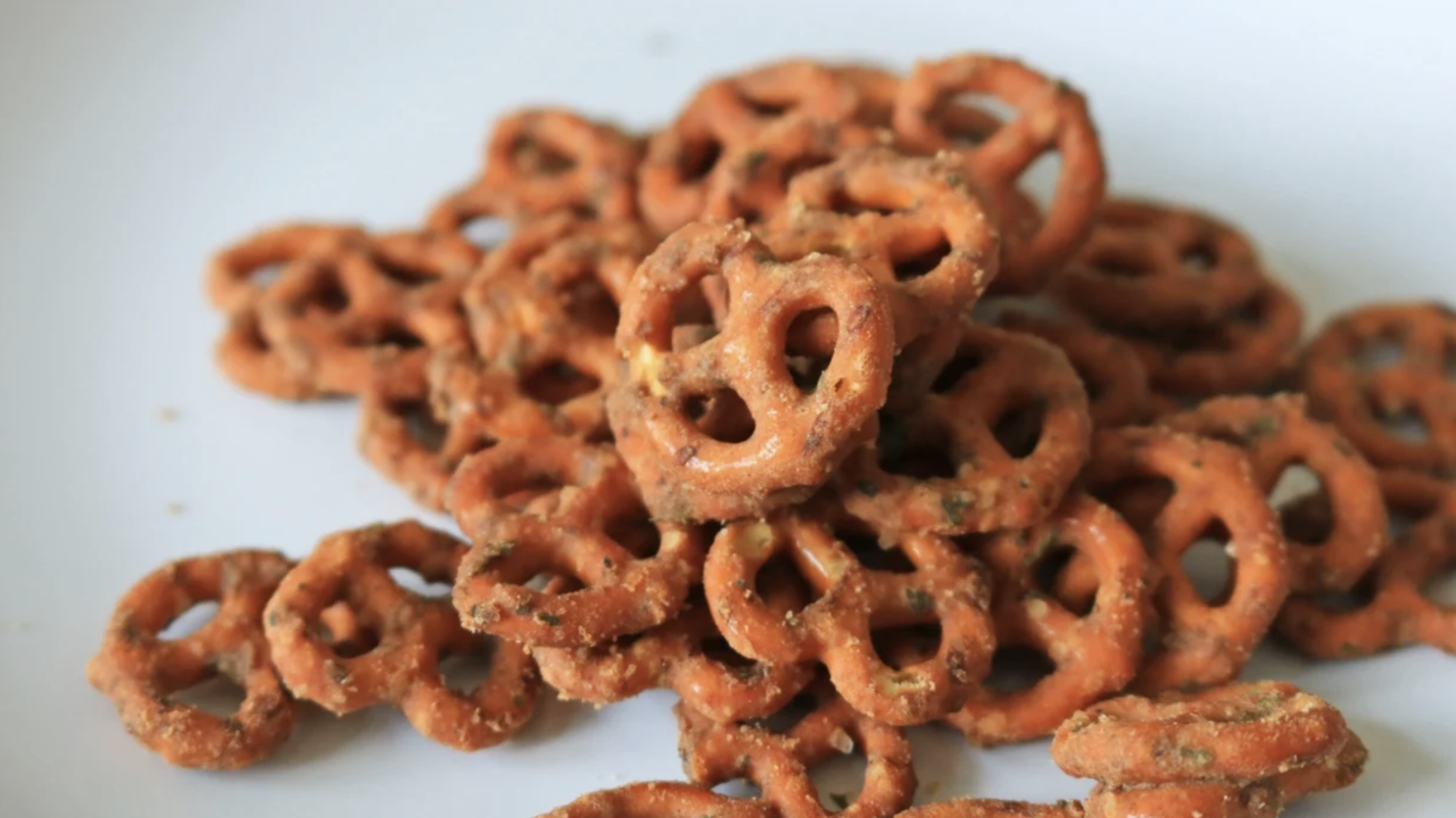 A pile of pretzels on a plate.